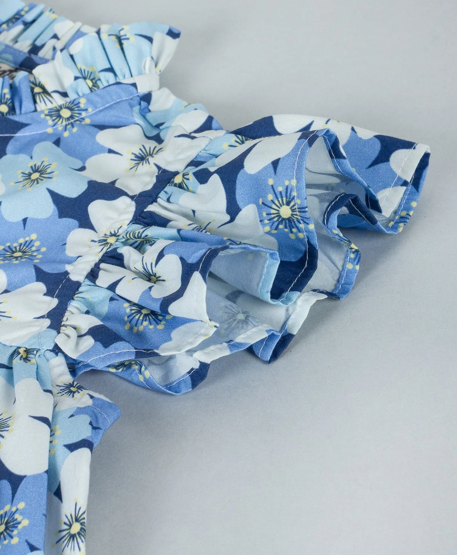 Floral print top with frills at neck & armhole with front button down opening-Blue
