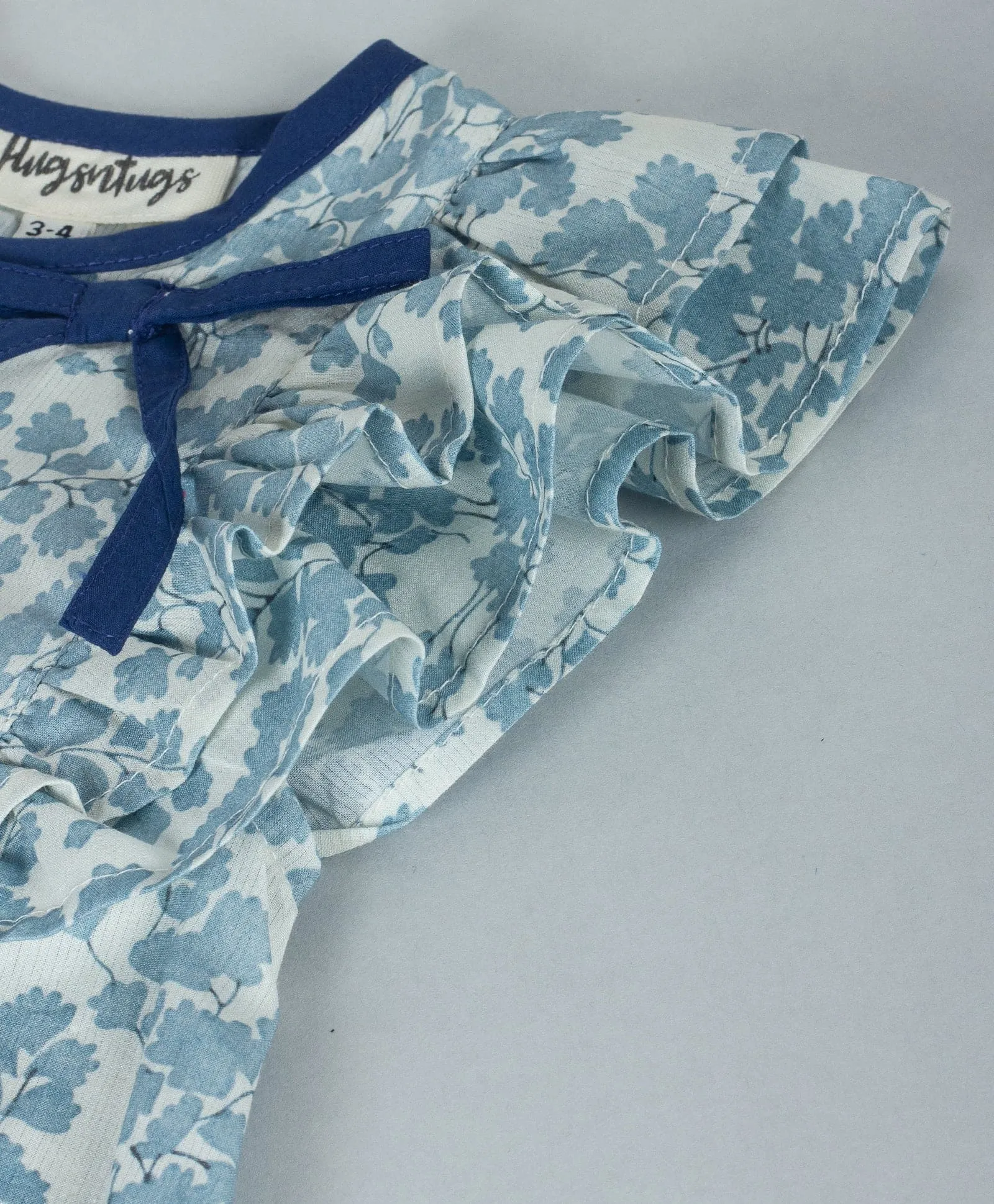 Floral top with contrast navy neck binding-Soft Blue